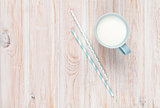 Cup of milk and drinking straws