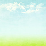 Blue sky, clouds and green field summer background