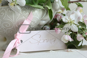 Apple blossom flowers in vase with gift card 