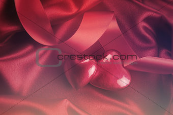 Red hearts on satin background