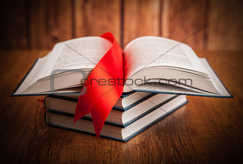stack of books with bookmark