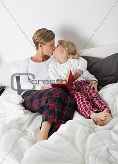 Mother and Daughter kissing