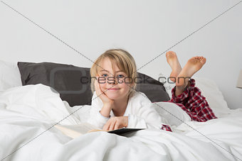 Happy Young Girl Reading a book