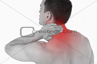 Young man experiencing neck pain