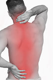 Rear view of shirtless man with neck pain over