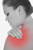 Upset woman suffering from shoulder pain