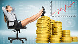 Businesswoman sitting on office chair with golden coins