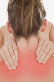 Young woman massaging neck