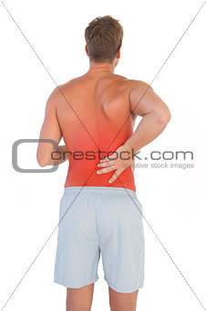 Man with shorts suffering from back pain