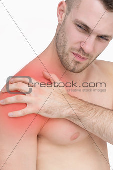 Closeup of shirtless man with shoulder pain