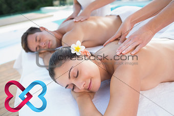 Composite image of attractive couple enjoying couples massage poolside