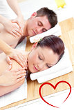 Composite image of attractive young couple receiving a back massage
