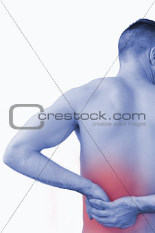 Rear view of shirtless man with backache