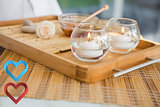 Composite image of candles and beauty treatment on tray