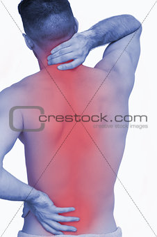 Rear view of shirtless man with neck pain over
