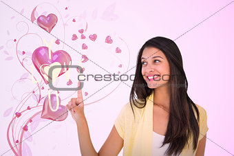 Composite image of happy casual woman pointing up