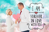 Composite image of older affectionate couple holding pink heart shape