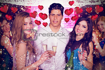 Composite image of friends drinking champagne
