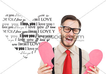 Composite image of geeky hipster crying and holding broken heart card