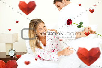 Composite image of attentive man giving a rose to his wife