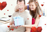 Composite image of smiling woman giving a present to her boyfriend
