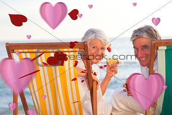 Composite image of senior couple drinking a cocktail
