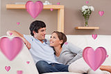 Composite image of couple on the sofa in love