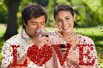Composite image of woman smiling while her friend is drinking wine