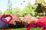 Composite image of two smiling friends with their eyes closed while lying head to head