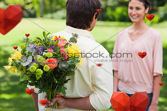 Composite image of man about to present a bouquet of flowers to his friend
