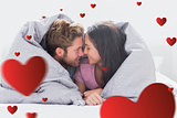 Composite image of couple wrapped in the duvet
