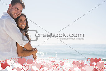 Composite image of smiling couple hugging and looking