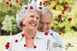 Composite image of happy mature couple laughing
