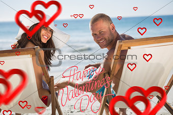 Composite image of cute couple looking while lying on their deck chairs