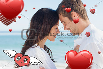 Composite image of romantic couple relaxing and embracing on the beach