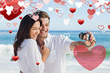 Composite image of happy couple taking a photo