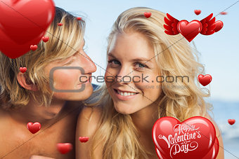 Composite image of close up view of couple lying while woman looking