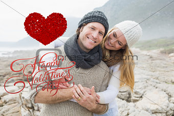 Composite image of romantic couple standing together on rocky landscape