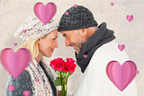 Composite image of smiling couple in winter fashion posing with roses