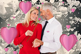 Composite image of handsome man giving his wife a pink rose