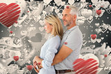 Composite image of happy couple smiling and embracing