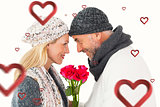 Composite image of smiling couple in winter fashion posing with roses
