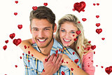 Composite image of attractive couple embracing and smiling at camera