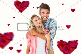 Composite image of attractive young couple smiling together