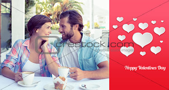 Composite image of happy couple enjoying coffee together