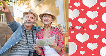 Composite image of happy tourist couple looking at map on a bench in the city