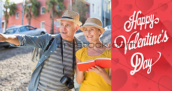 Composite image of happy tourist couple using guide book in the city