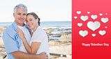Composite image of happy casual couple embracing by the sea