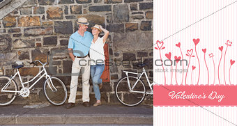 Composite image of happy senior couple going for a bike ride in the city