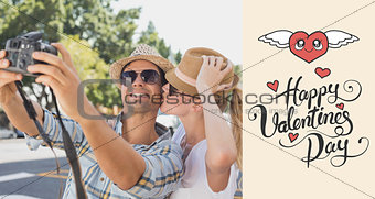 Composite image of young hip couple taking a selfie